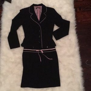 Stylish black suit with pink piping